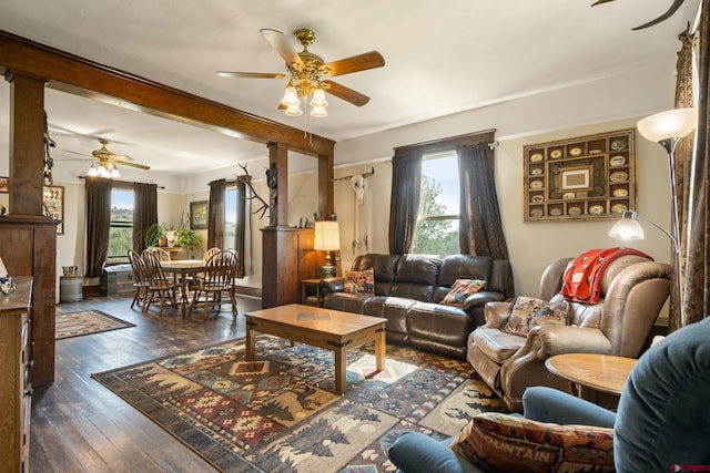 living room featuring ceiling fan and dark wood-type flooring