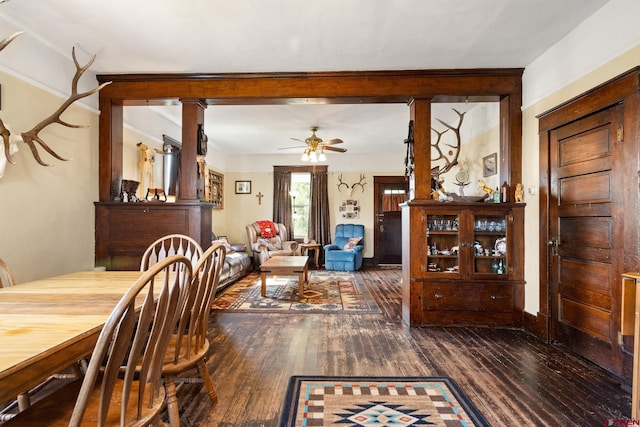 dining space featuring ceiling fan and dark hardwood / wood-style floors