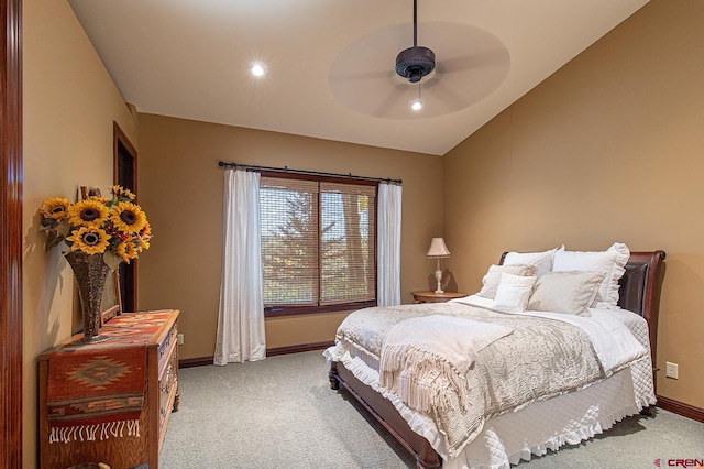 carpeted bedroom with vaulted ceiling and ceiling fan