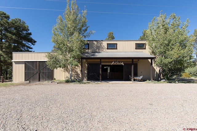 view of front of house featuring an outdoor structure