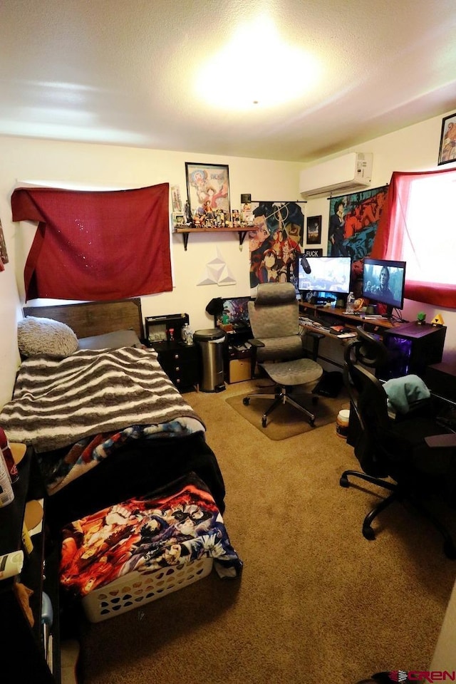 bedroom with an AC wall unit and carpet