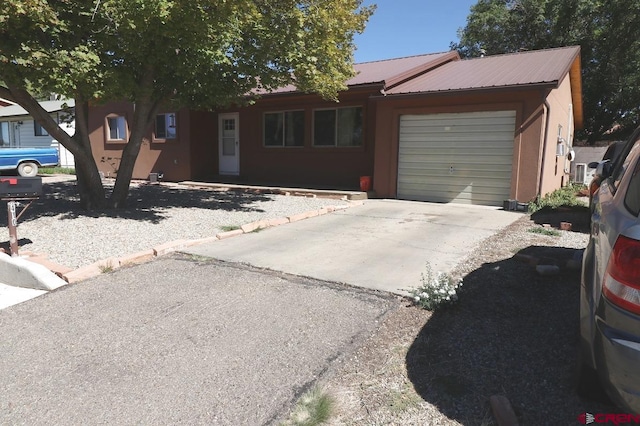 single story home with a garage