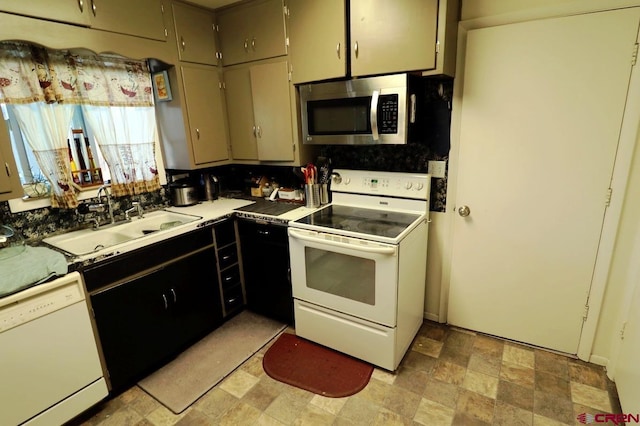 kitchen with decorative backsplash, white appliances, and sink