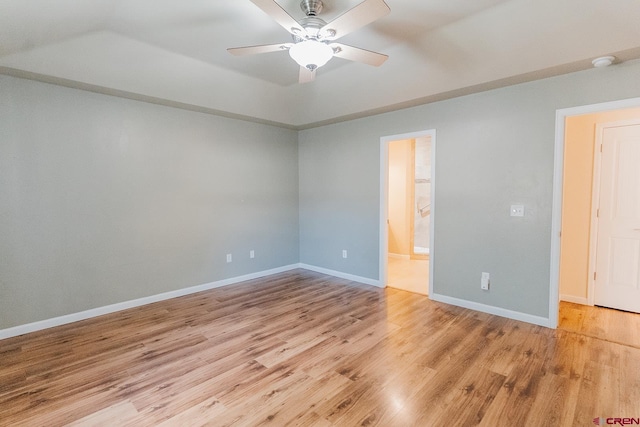 empty room featuring ceiling fan and light hardwood / wood-style flooring