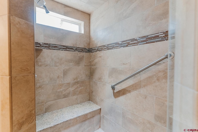 bathroom featuring tiled shower