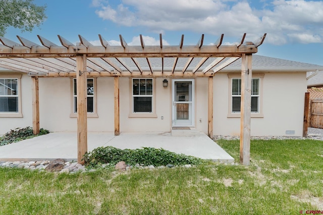 rear view of house featuring a patio area and a yard