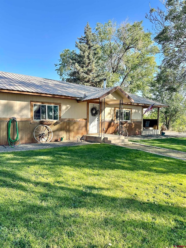 ranch-style home featuring a patio and a front yard