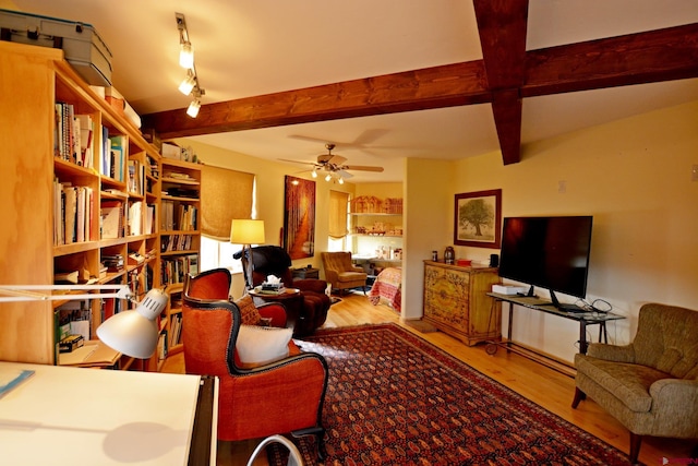 living room with beam ceiling, ceiling fan, and hardwood / wood-style floors