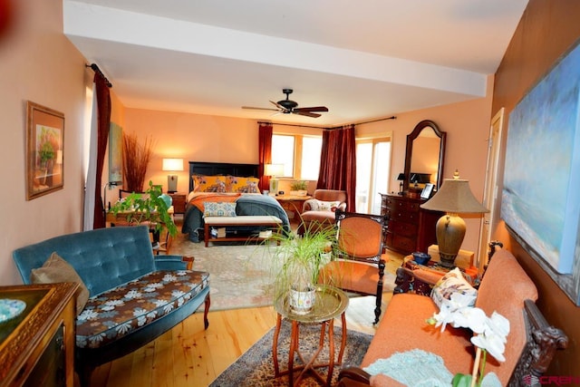 bedroom with wood-type flooring and ceiling fan