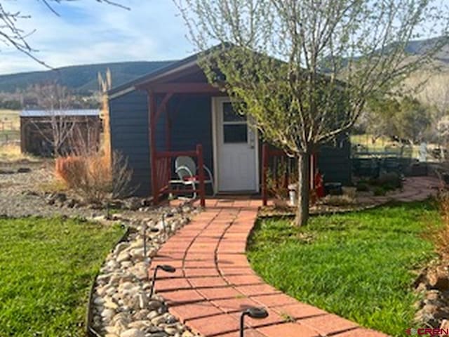 view of outdoor structure with a lawn