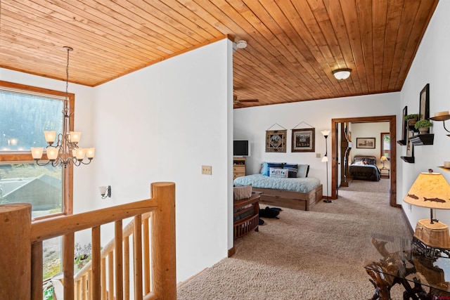 corridor featuring light colored carpet, a notable chandelier, and wood ceiling