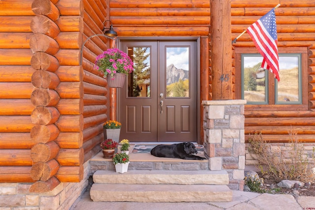 view of exterior entry featuring french doors