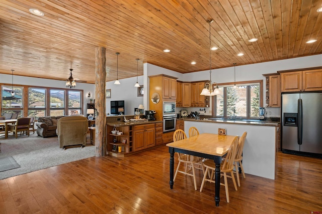 dining space featuring wood ceiling, ceiling fan, and hardwood / wood-style flooring