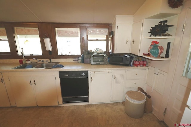 kitchen with white cabinets, sink, and black appliances