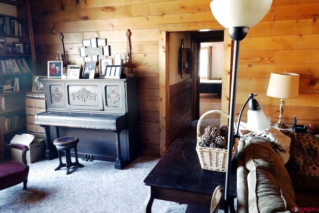 410 E Empire St, Cortez, CO 81321 - living area featuring wood walls and carpet flooring