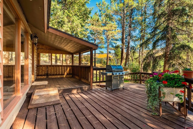 wooden deck featuring area for grilling