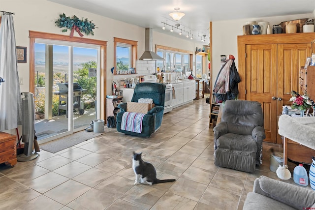 tiled living room with plenty of natural light