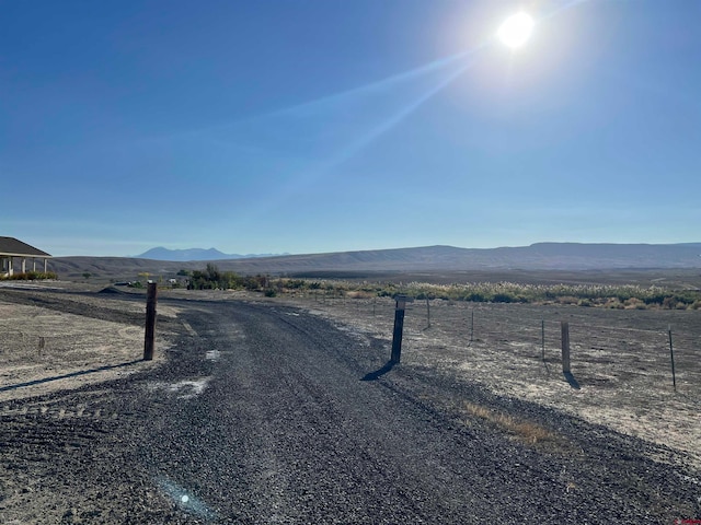 view of street featuring a rural view and a mountain view