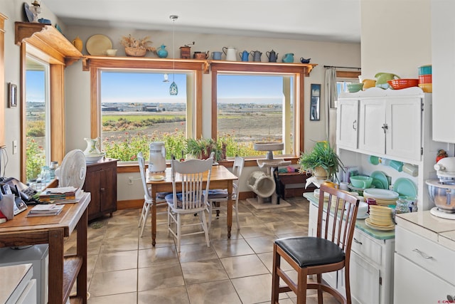 dining space with light tile patterned floors