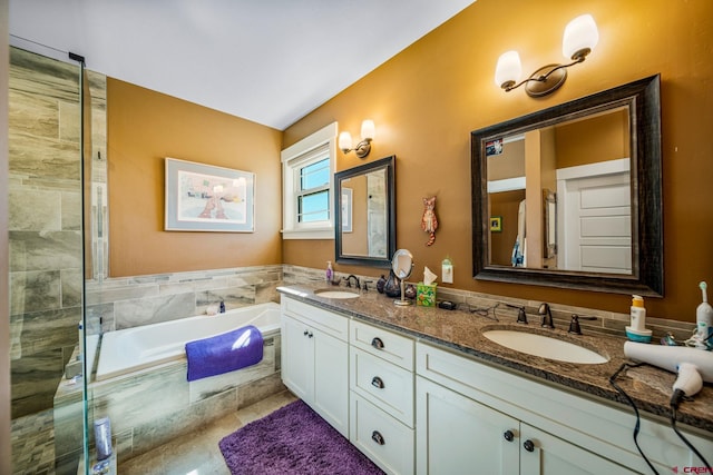 bathroom featuring vanity and plus walk in shower