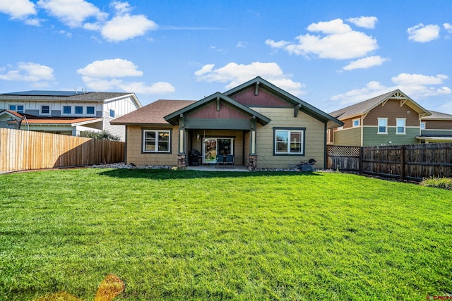 back of property featuring a patio and a yard