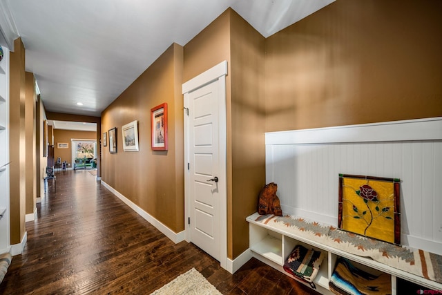 hallway with dark wood-type flooring