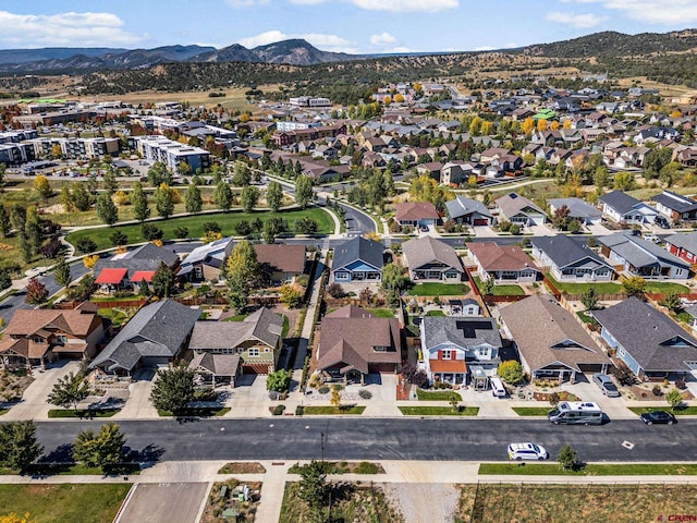 birds eye view of property with a mountain view