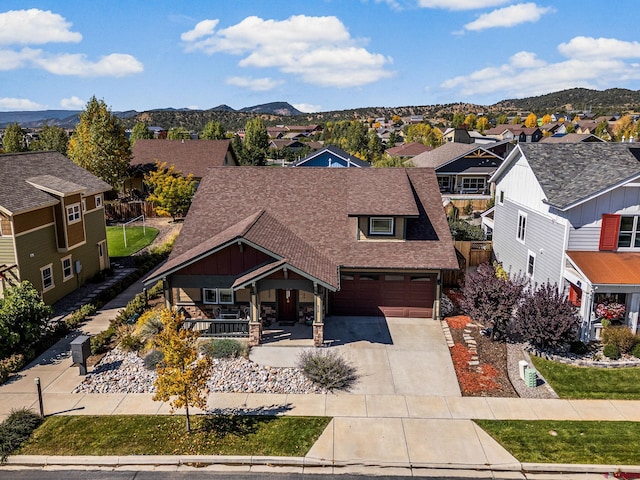 view of front facade featuring a mountain view and a porch