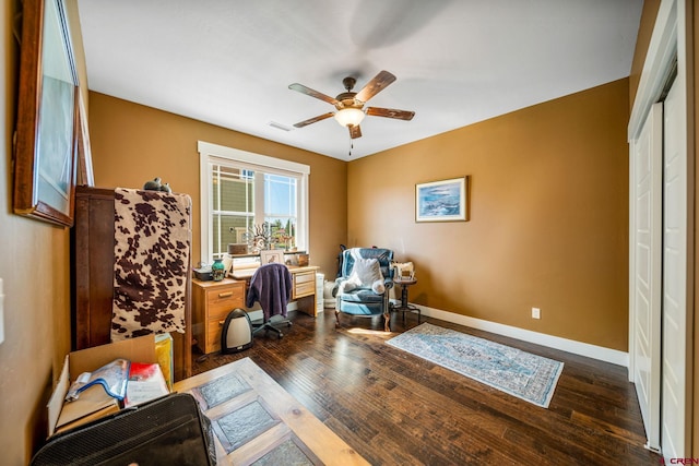 home office featuring ceiling fan and dark hardwood / wood-style flooring