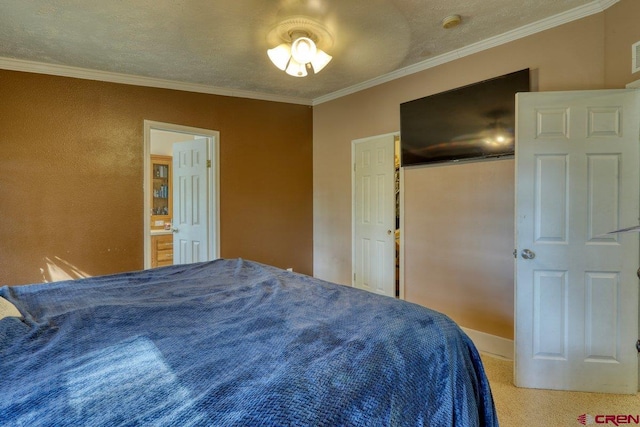 bedroom featuring ceiling fan, carpet flooring, a textured ceiling, and ornamental molding