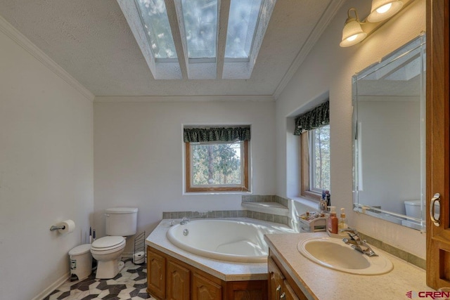 bathroom featuring ornamental molding, a textured ceiling, a tub to relax in, and toilet