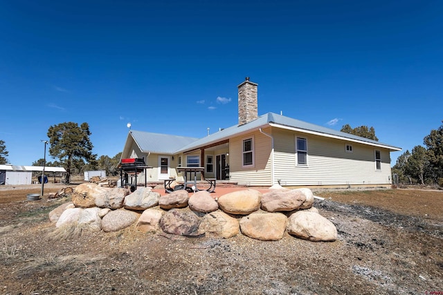 rear view of house featuring a patio