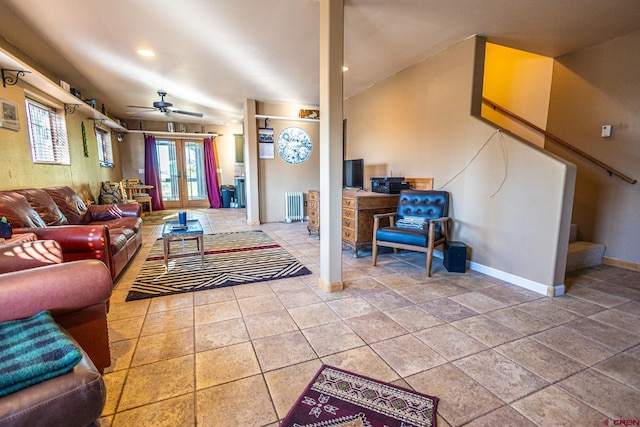 living room featuring radiator and ceiling fan