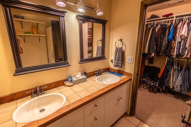 bathroom featuring tile patterned floors and vanity