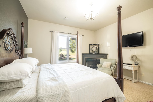 carpeted bedroom featuring a tile fireplace