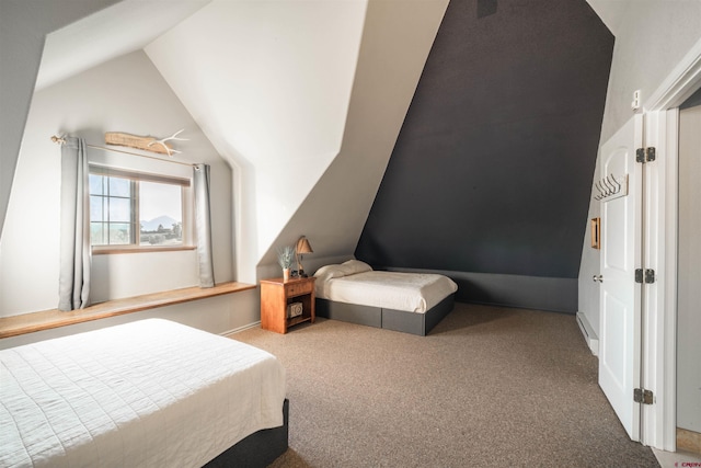 carpeted bedroom featuring vaulted ceiling