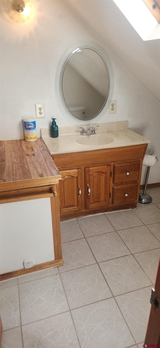 bathroom with vanity and tile patterned floors