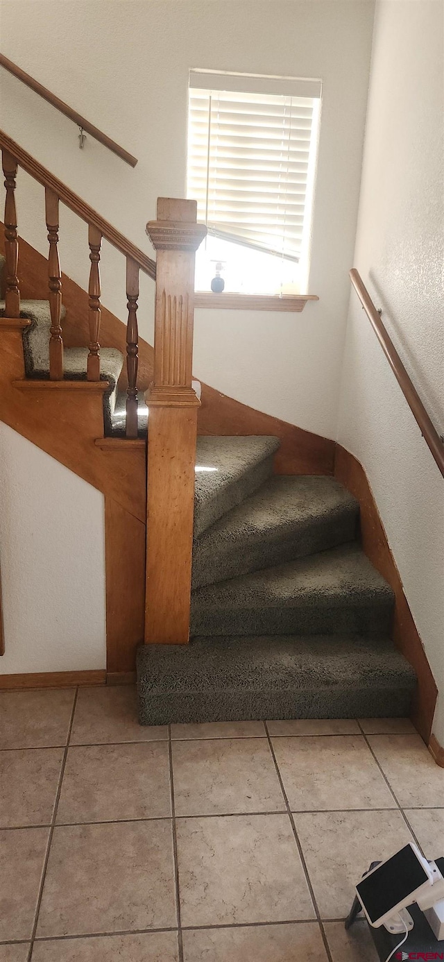 stairs with tile patterned flooring