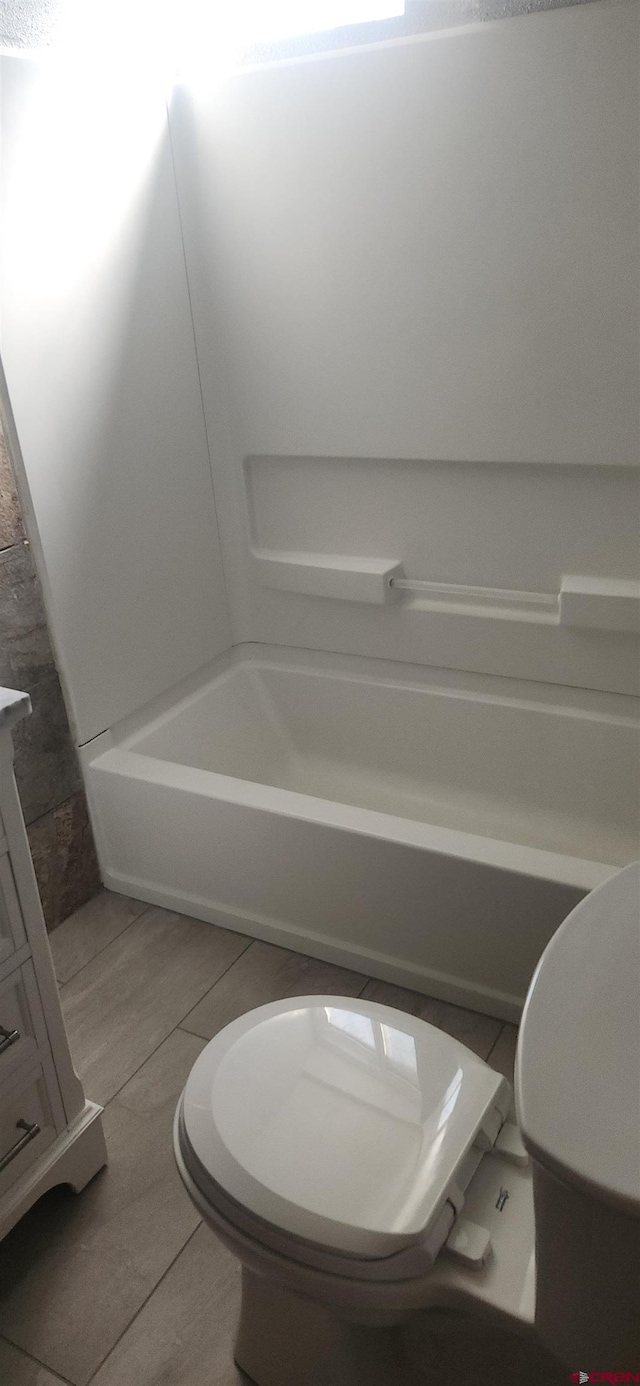 bathroom featuring toilet, independent shower and bath, and tile patterned floors