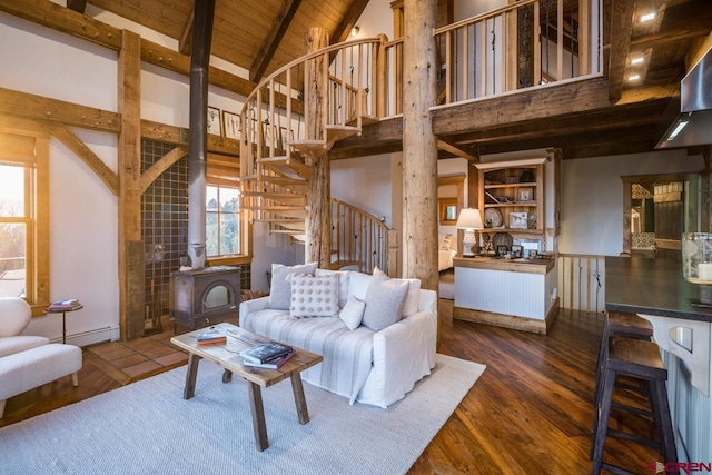 living room featuring high vaulted ceiling, a wood stove, dark wood-type flooring, wooden ceiling, and a baseboard radiator