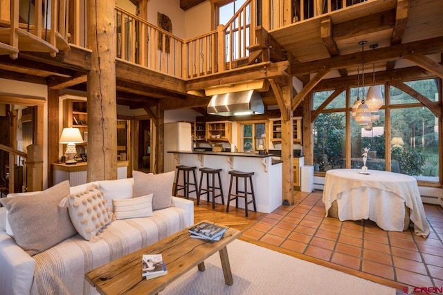 living room featuring light tile patterned floors and a high ceiling