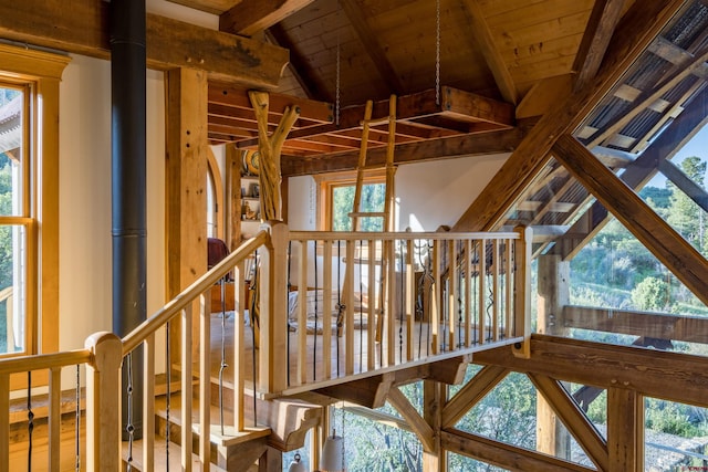 interior space with beamed ceiling and wooden ceiling