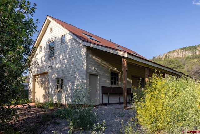 462 Dragon Lode Dr, Placerville, CO 81430 - back of house with metal roof and a garage