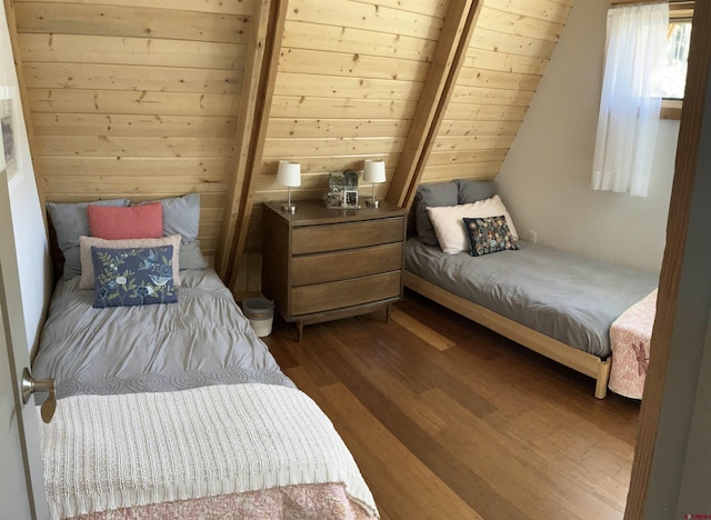 bedroom featuring lofted ceiling with beams, hardwood / wood-style floors, and wood ceiling