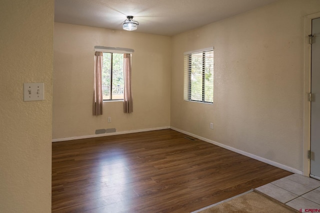 empty room featuring wood-type flooring