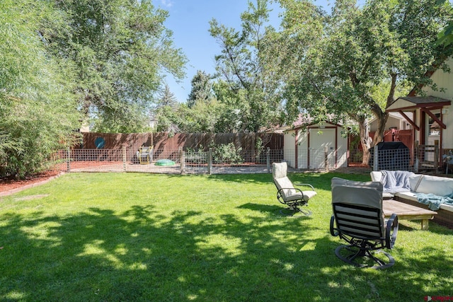 view of yard with a storage unit