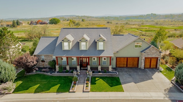 view of front of property featuring a front yard and covered porch