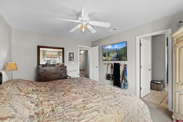 bedroom with light colored carpet and ceiling fan