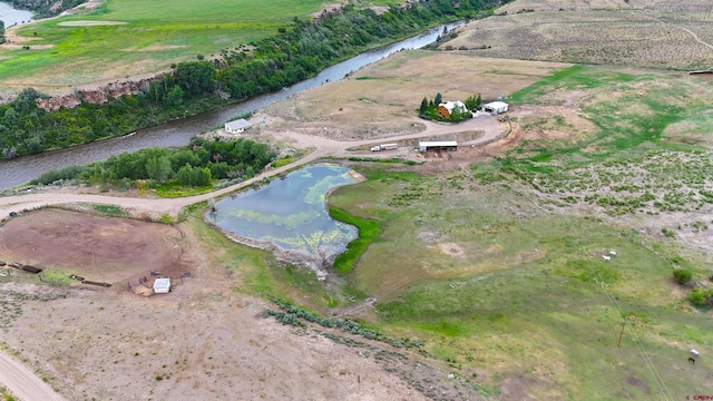 drone / aerial view featuring a water view and a rural view