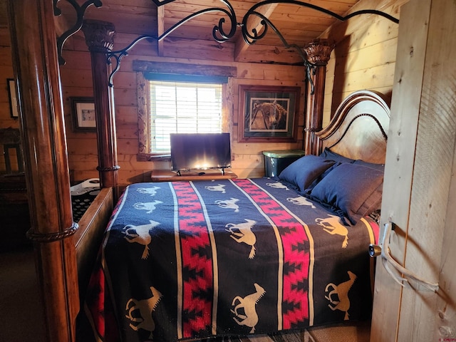 bedroom featuring wood walls